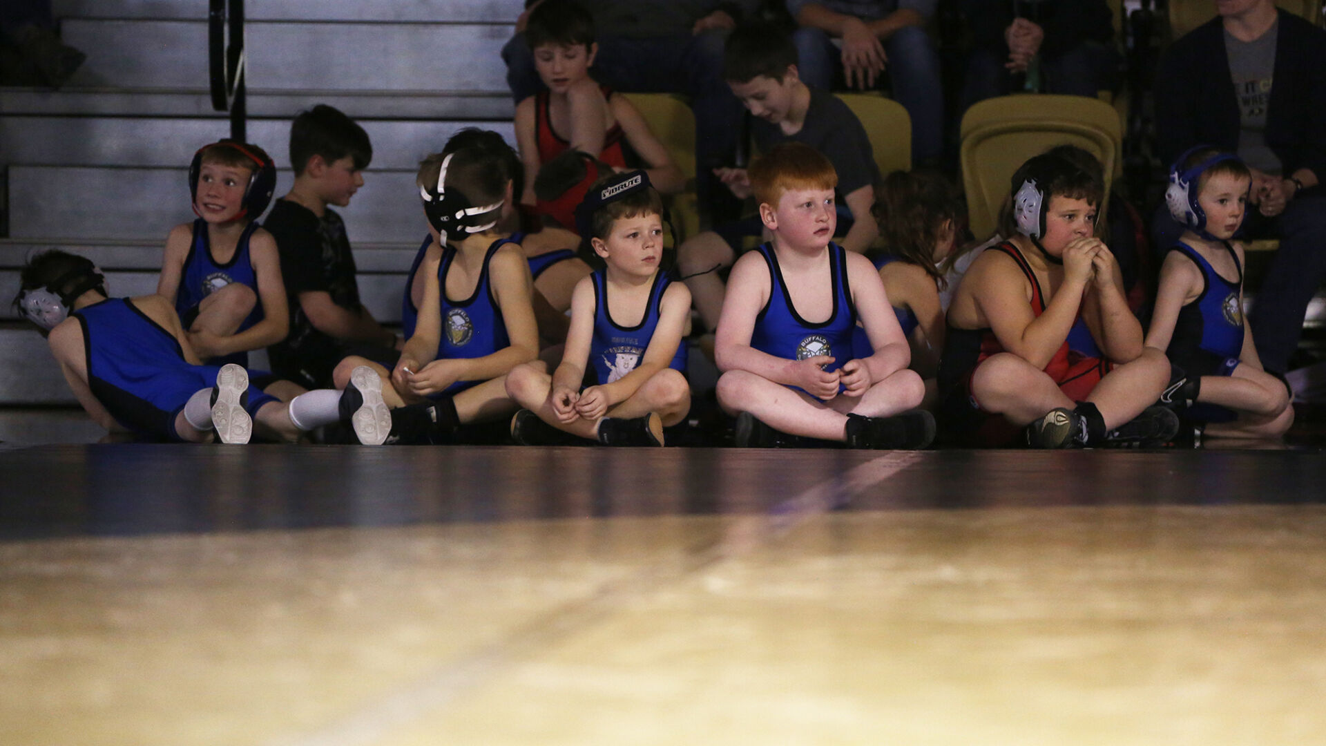 Buffalo's youth wrestlers watch the high schoolers wrestle